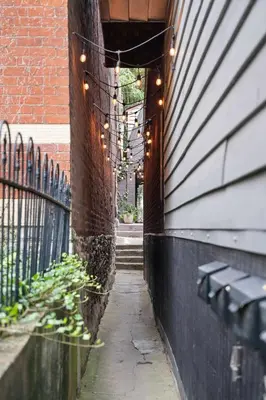 a string of lights on the side of a building at Close to Stadiums, Downtown Cincy, & more, 1BR Apt in Ludlow
