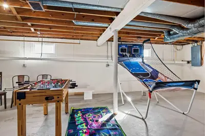 a room with a ping pong table and a hammock at 6 Min to Ark, Free Covered Parking, Deck and Grill in Williamstown