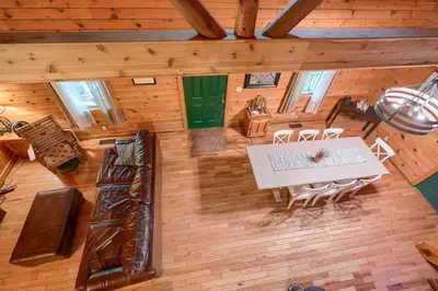 an overhead view of a dining room with a table and chairs at Blue Rose Cabins - Oleander Cabin in Logan