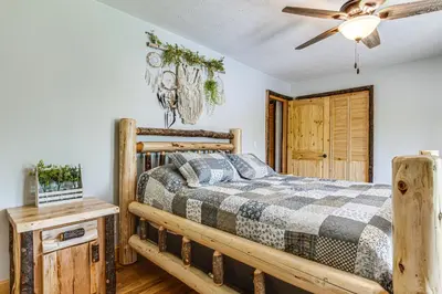 a bedroom with a bed and a ceiling fan at Family-Friendly Milton Home on 14 Acres with Hot Tub in Milton