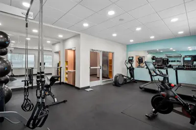 a gym with treadmills and elliptical machines at Tru By Hilton Wauseon in Wauseon