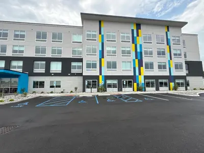 an empty parking lot in front of a building at Tru By Hilton Wauseon in Wauseon