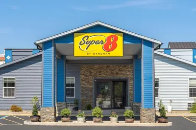 a super restaurant with a sign on it at Super 8 by Wyndham Fort Wayne in Fort Wayne