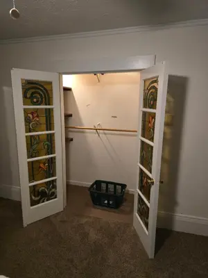 an empty room with two doors and a basket at Unit 2 at Oilgate at Oakdale in Akron