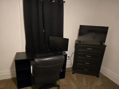 a desk with a computer and a chair and a dresser at Unit 2 at Oilgate at Oakdale in Akron