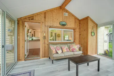 a living room with a couch and a table at Thornville Home with Boat Dock On the Lake! in Hebron