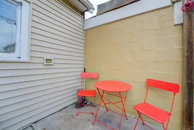 two red chairs and a red table next to a wall at Retro 1970's Rollercoaster House 5 Mins from Cedar Point in Sandusky