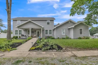 a home with a gray house at Four-Bedroom House in Lapel