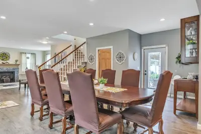 a dining room with a table and chairs at Four-Bedroom House in Lapel