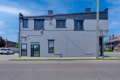 a white building on the corner of a street at River City Loft in Portsmouth