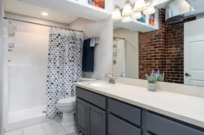 a bathroom with a sink and a toilet at Unique and Charming Downtown Apt in Newark