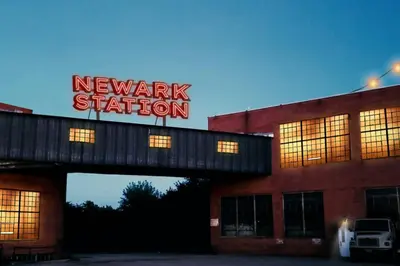a newark station sign on top of a building at Unique and Charming Downtown Apt in Newark