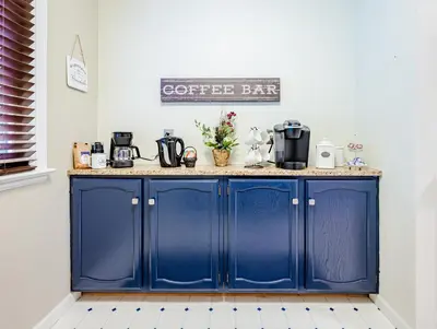 a blue cabinet with a coffee bar sign above it at Rachel's Private Hideaway with king bed, kitchen, laundry, parking and big yard in Toledo