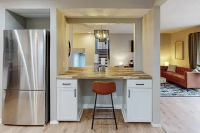 a kitchen with a counter and a refrigerator at Game Day Getaway-Play Relax Make Memories in Canton
