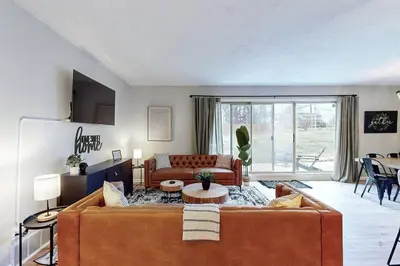 a living room with a couch and a table at Game Day Getaway-Play Relax Make Memories in Canton