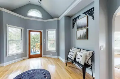 a living room with blue walls and a bench at Hidden Acres Escape-A Bluegrass Retreat in Blaine