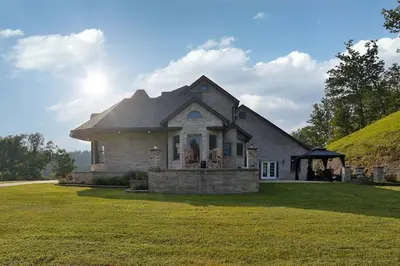 a large house with a grassy yard at Hidden Acres Escape-A Bluegrass Retreat in Blaine