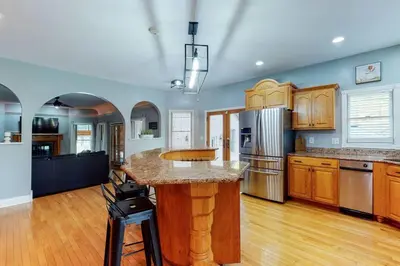 a large kitchen with a island in the middle at Hidden Acres Escape-A Bluegrass Retreat in Blaine