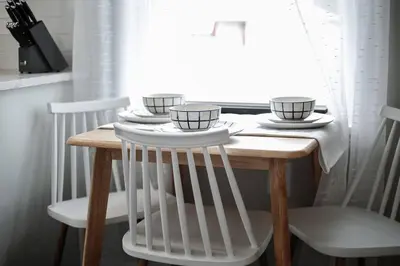 a wooden table with three cups on top of it at Touchdown Bungalow-Charming HOF Village Home in Canton