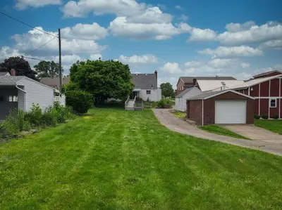 a yard of a house with green grass at Football Hall of Fame Hideaway-Cozy and Convenient in Canton