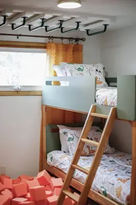 a room with two bunk beds and a ladder at Gridiron Getaway-Where Families and Fans Unite in Canton