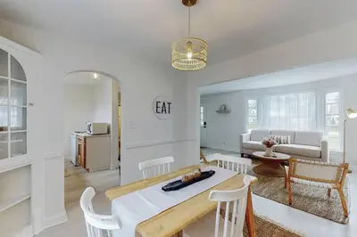 a kitchen and living room with a table and chairs at The Perfect Pass-HOF Village Escape in Canton