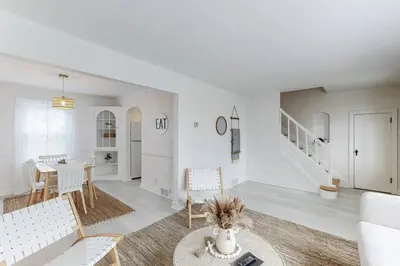 a living room with a couch and a table at The Perfect Pass-HOF Village Escape in Canton