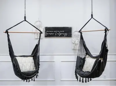 two hammocks hanging from a wall in a room at Eternal Romance-The Honeymoon Suite at 1885 Farms in Navarre