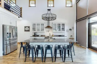 a large kitchen with a large island with bar stools at Some Kind of Wonderful-Escape Near Seneca Lake in Senecaville