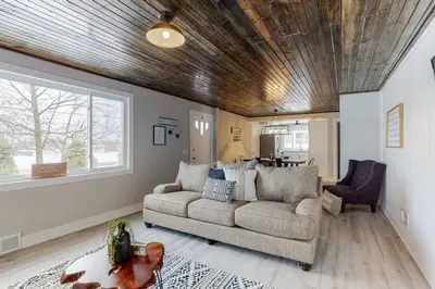 a living room with a couch and a table at Steps to the HOF-Football Fans Dream Stay in Canton