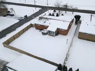 an aerial view of roofs of houses covered in snow at Steps to the HOF-Football Fans Dream Stay in Canton