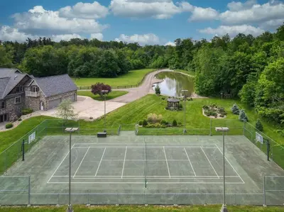 an aerial view of a tennis court at Grace and Grandeur-The Stables Estate in North Lawrence