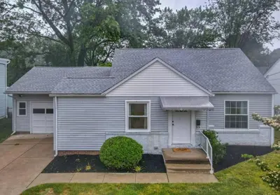 a house with a gray roof at The Playmakers Funhouse-HOF Village in Canton