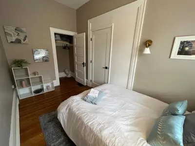 a bedroom with a white bed in a room at 2 BR Totally Renovated and Chic in Columbus