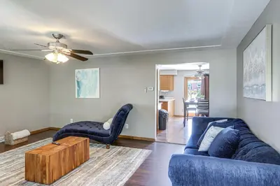 a living room with a couch and a table at Lake Erie Family Getaway in Amherst Pets Welcome! in Amherst