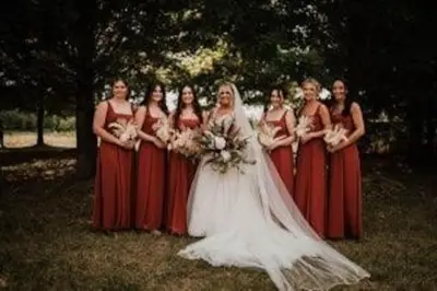 a group of women in red and white dresses at The Estate House-Timeless Elegance at 1885 Farms in Navarre