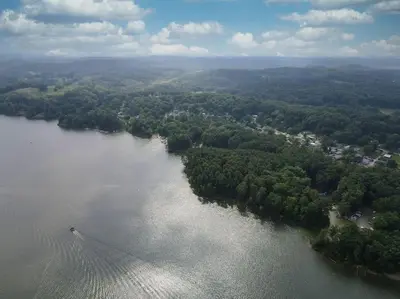 an aerial view of a river with a bridge at Atwood Breeze-Tranquil Lake Escape in Sherrodsville