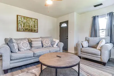 a living room with a couch and two chairs and a table at Cozy Muncie Home Near Downtown in Muncie