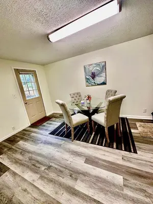 a dining room with a table and chairs at Cozy Muncie Home Near Downtown in Muncie