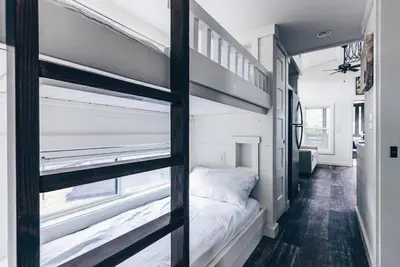 a bedroom with a bunk bed in a tiny house at Cincinnati Camp Cedar in Mason