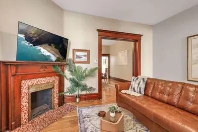 a living room with a couch and a fireplace at 4 Bed Duplex near Goodale Park in Columbus