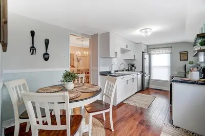 a kitchen and dining room with a table and chairs at General Mitchel Historic Home in Downtown Lebanon in Lebanon