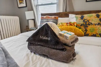 a pile of towels sitting on a bed at Tiny Taco House in Lakewood