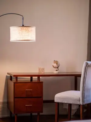 a desk with a lamp and a chair at Carriage Manor - Sun Soaked 1BR - Close to CCF in Cleveland