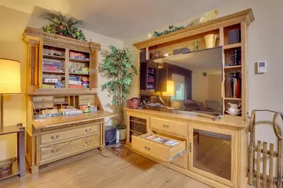 a home office with a desk and a mirror at Peaceful Carrollton Retreat with Deck and Fire Pit! in Carrollton