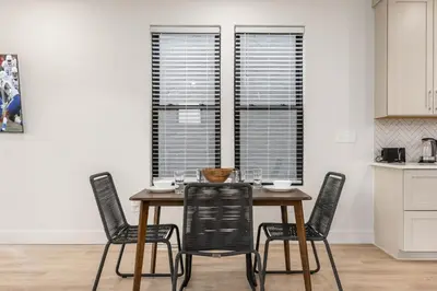 a dining room table and chairs in a kitchen at Stylish 4BR in Merion Village PD in Columbus