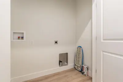 a room with a white wall and a radiator at Stylish 4BR in Merion Village PD in Columbus