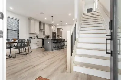 a staircase leading to a kitchen and a living room at Stylish 4BR in Merion Village PD in Columbus