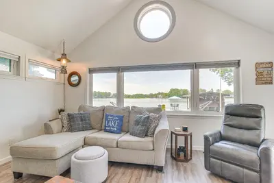 a living room with a couch and a chair at Waterfront with Boat Dock Retreat on Indian Lake in Lakeview