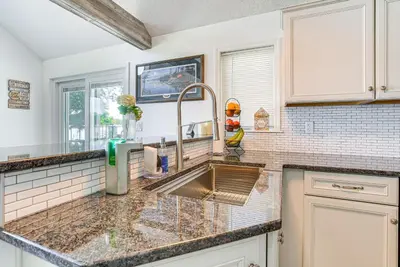 a kitchen with a sink and a counter at Waterfront with Boat Dock Retreat on Indian Lake in Lakeview